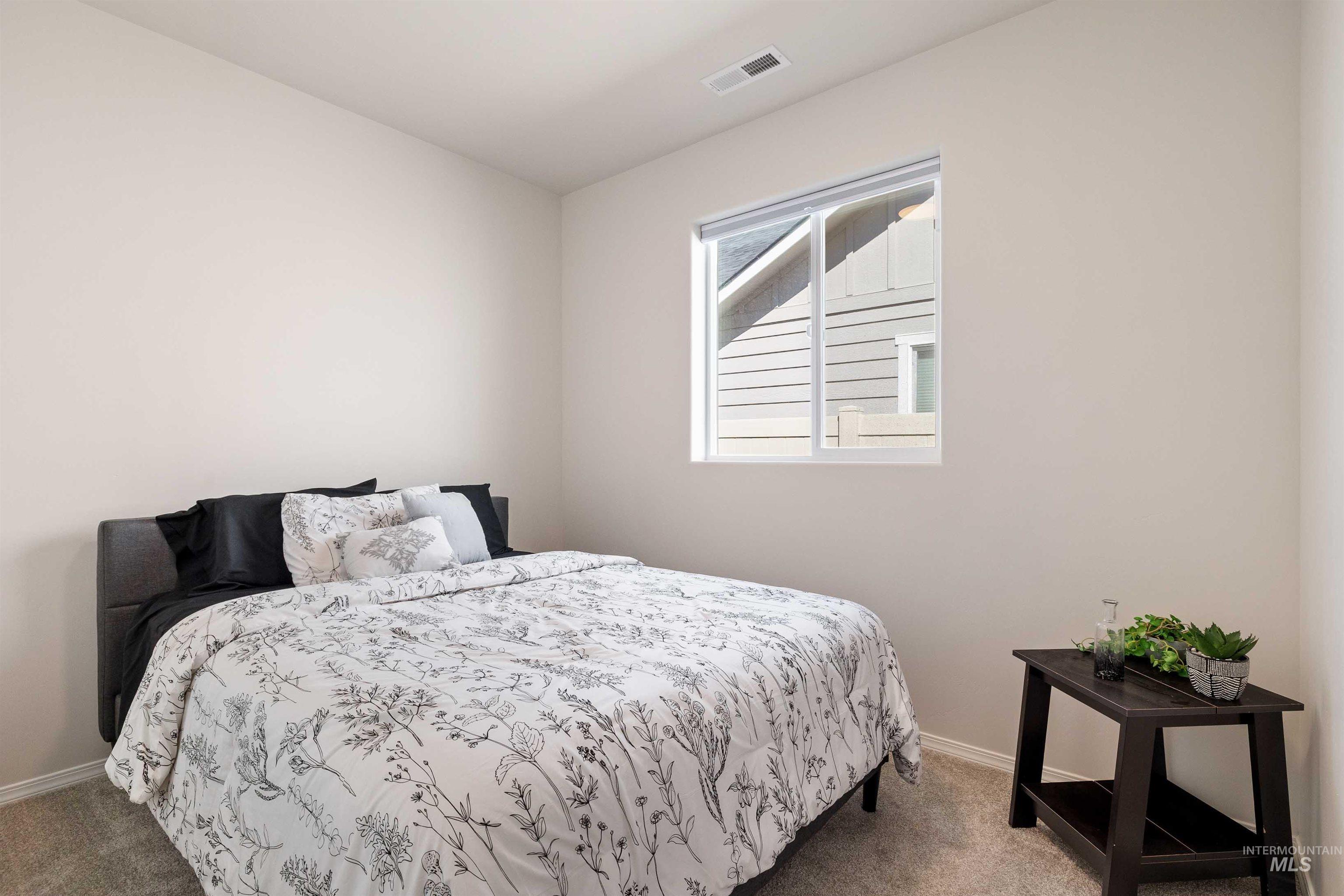 1603 Kenyon Mdw Street Twin Falls, ID 83301 - Photo 14 of 34 Bedroom with carpet floors and baseboards
