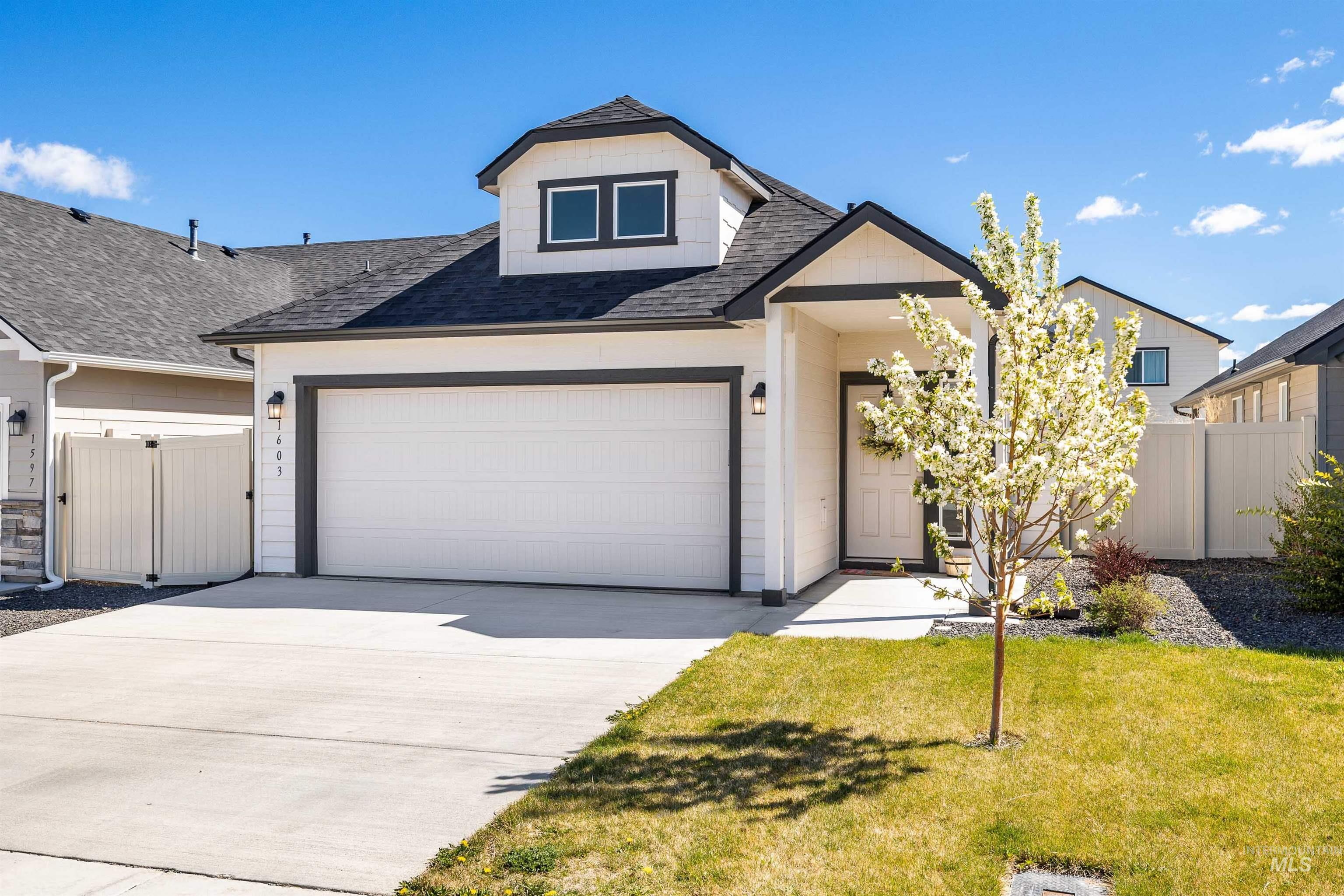 1603 Kenyon Mdw Street Twin Falls, ID 83301 - Photo 23 of 34 View of front of property featuring roof with shingles and driveway
