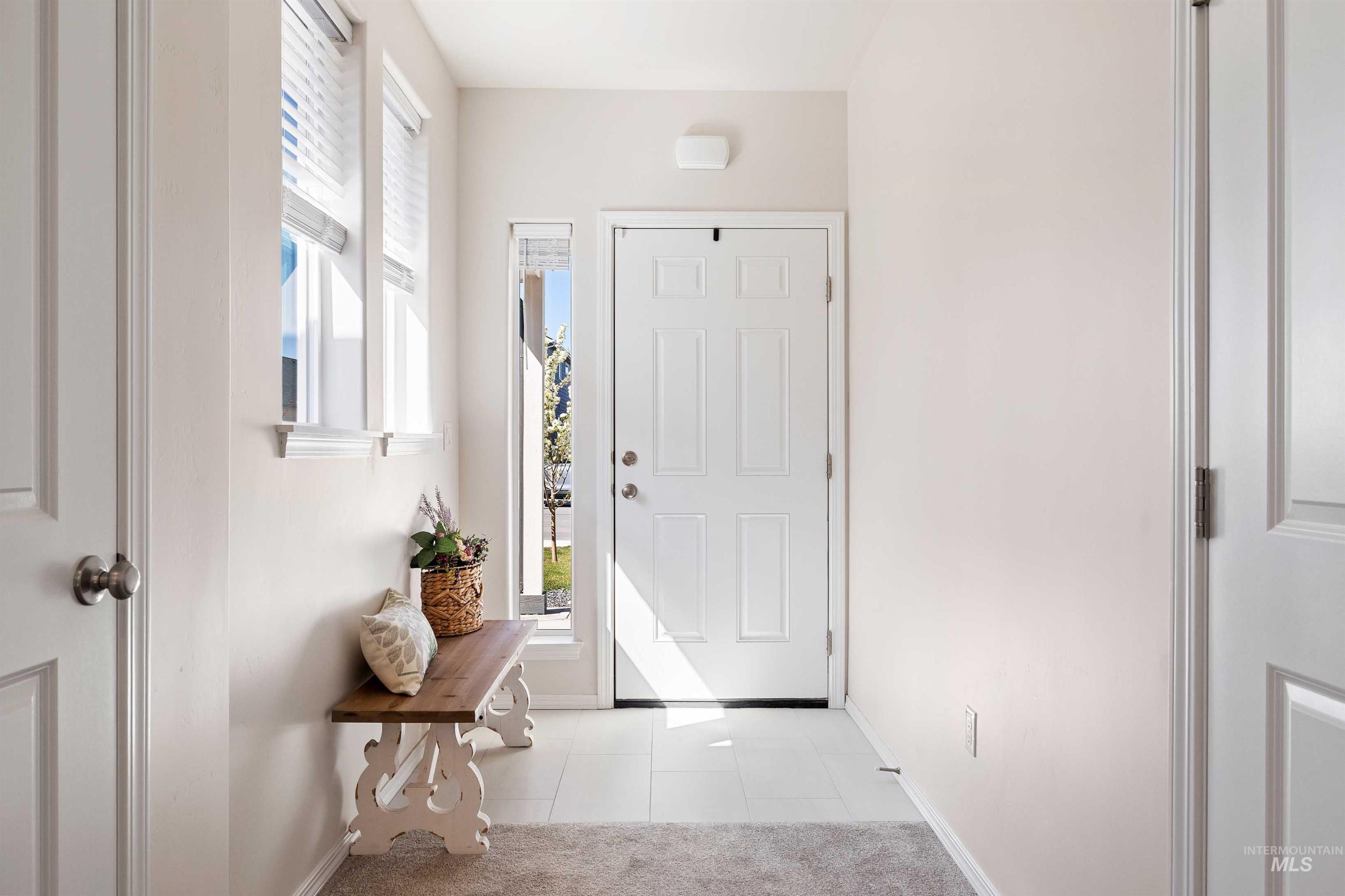 1603 Kenyon Mdw Street Twin Falls, ID 83301 - Photo 4 of 34 Entrance foyer with light tile patterned floors and baseboards