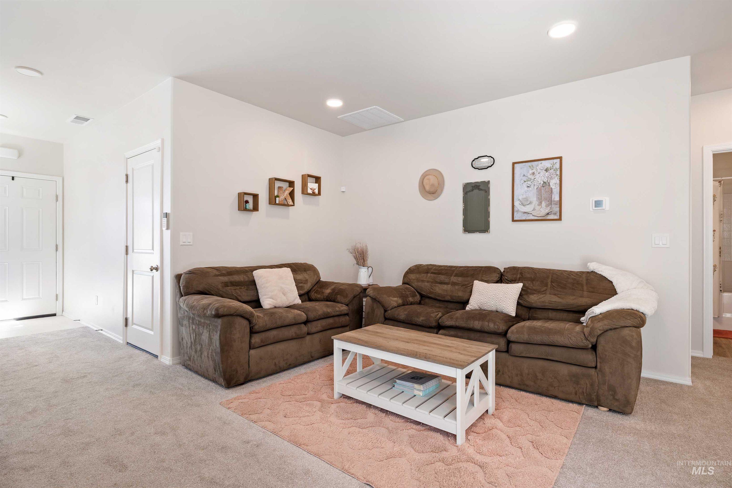 1603 Kenyon Mdw Street Twin Falls, ID 83301 - Photo 6 of 34 Living room with light carpet and recessed lighting