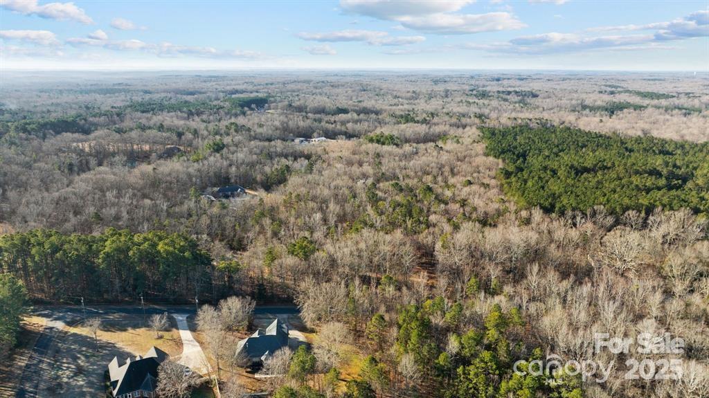 6521 Steele Road Waxhaw, NC 28173 - Photo 2 of 7 an aerial view of a house with a yard and mountain view in back