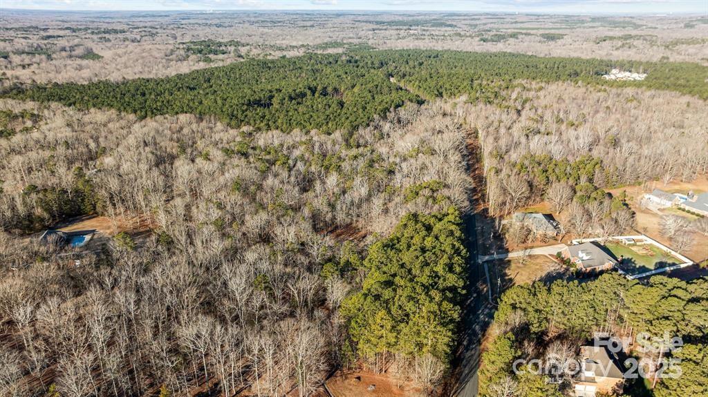 6521 Steele Road Waxhaw, NC 28173 - Photo 5 of 7 a view of a yard with an outdoor space