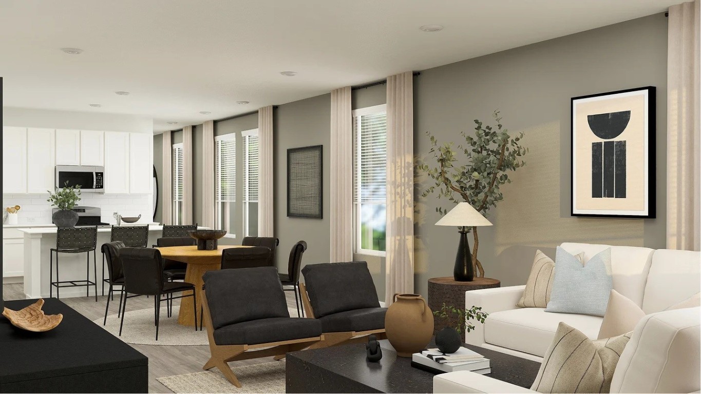 708 Rosa Bianca Way Huffman, TX 77336 - Photo 7 of 9 a living room with furniture and a potted plant