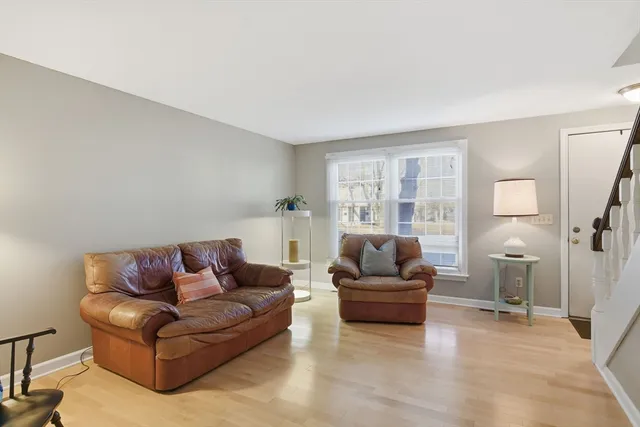 a living room with a couch and a window