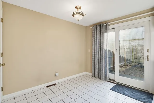 a view of a room with wooden floor and windows