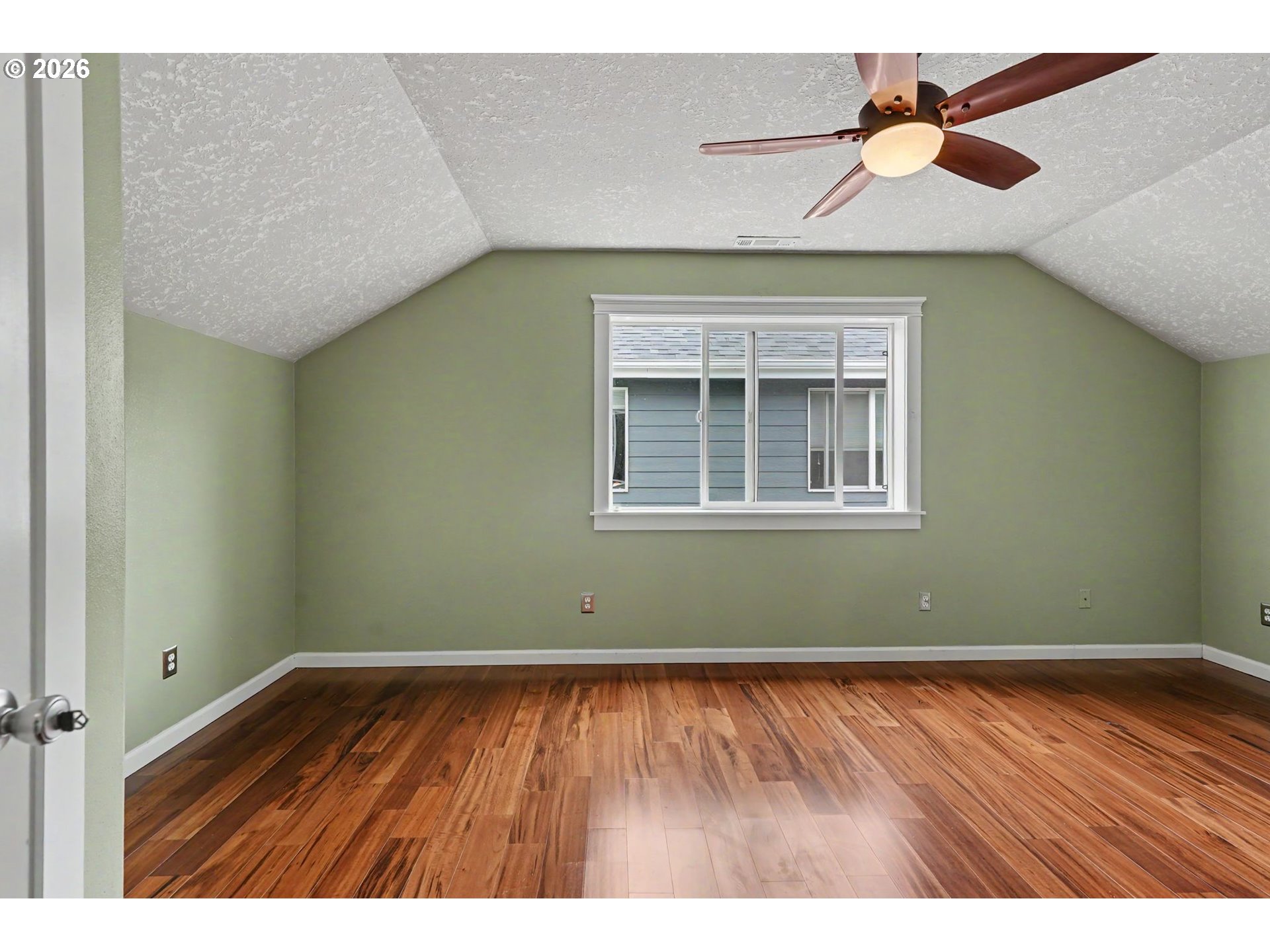 1462 Barnick Road Northeast Keizer, OR 97303 - Photo 30 of 48 a view of an empty room with window and wooden floor