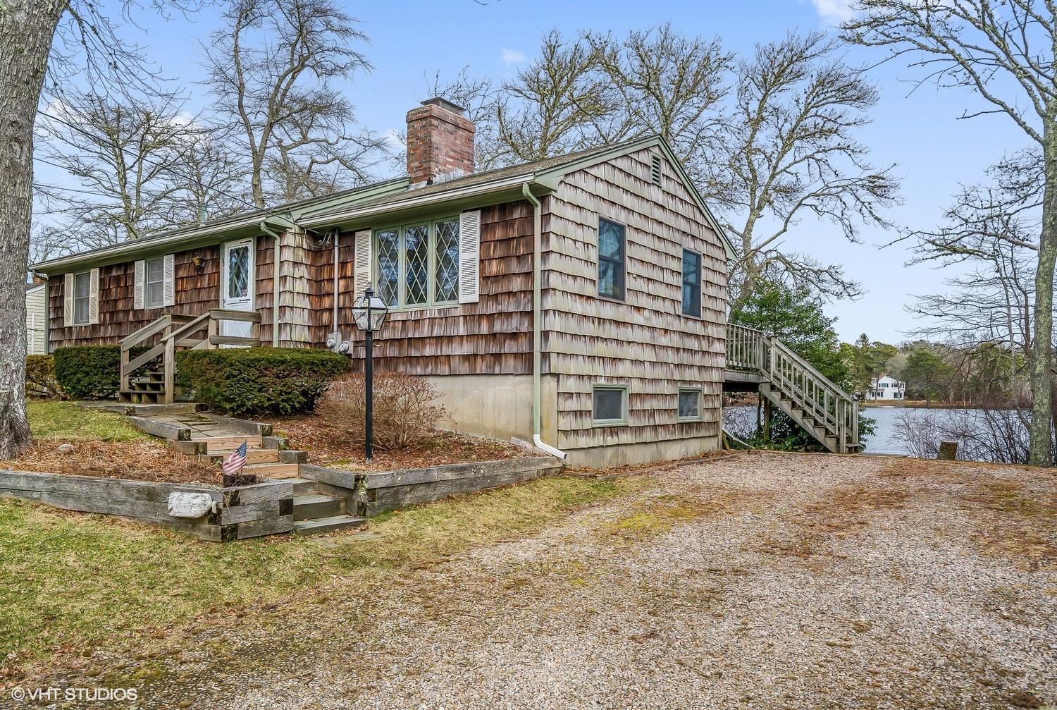 58 Nyes Point Way Centerville, MA 02632 - Photo 1 of 16 a view of a house with a yard