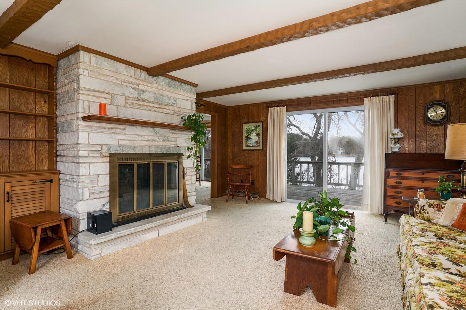 58 Nyes Point Way Centerville, MA 02632 - Photo 3 of 16 a living room with furniture and a fireplace