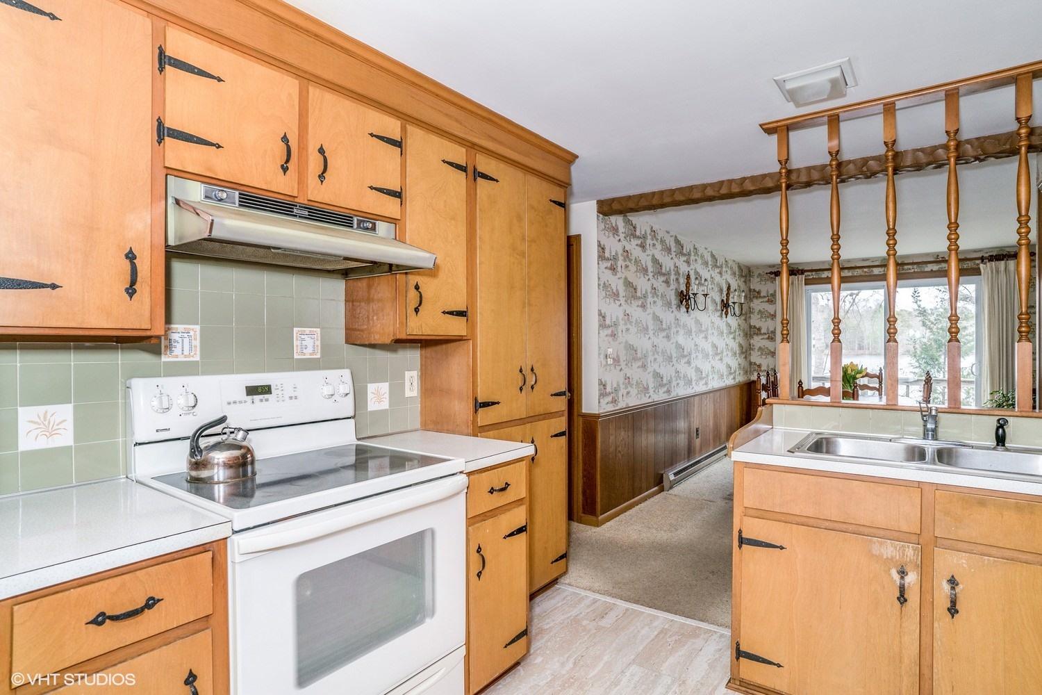 58 Nyes Point Way Centerville, MA 02632 - Photo 6 of 16 a kitchen with stainless steel appliances a sink stove and cabinets