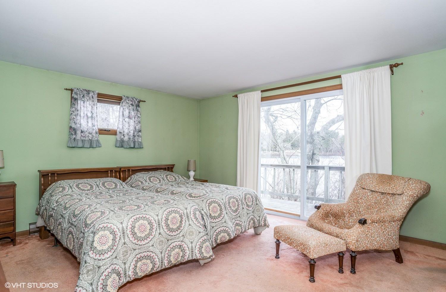58 Nyes Point Way Centerville, MA 02632 - Photo 7 of 16 a bedroom with a bed and a chair