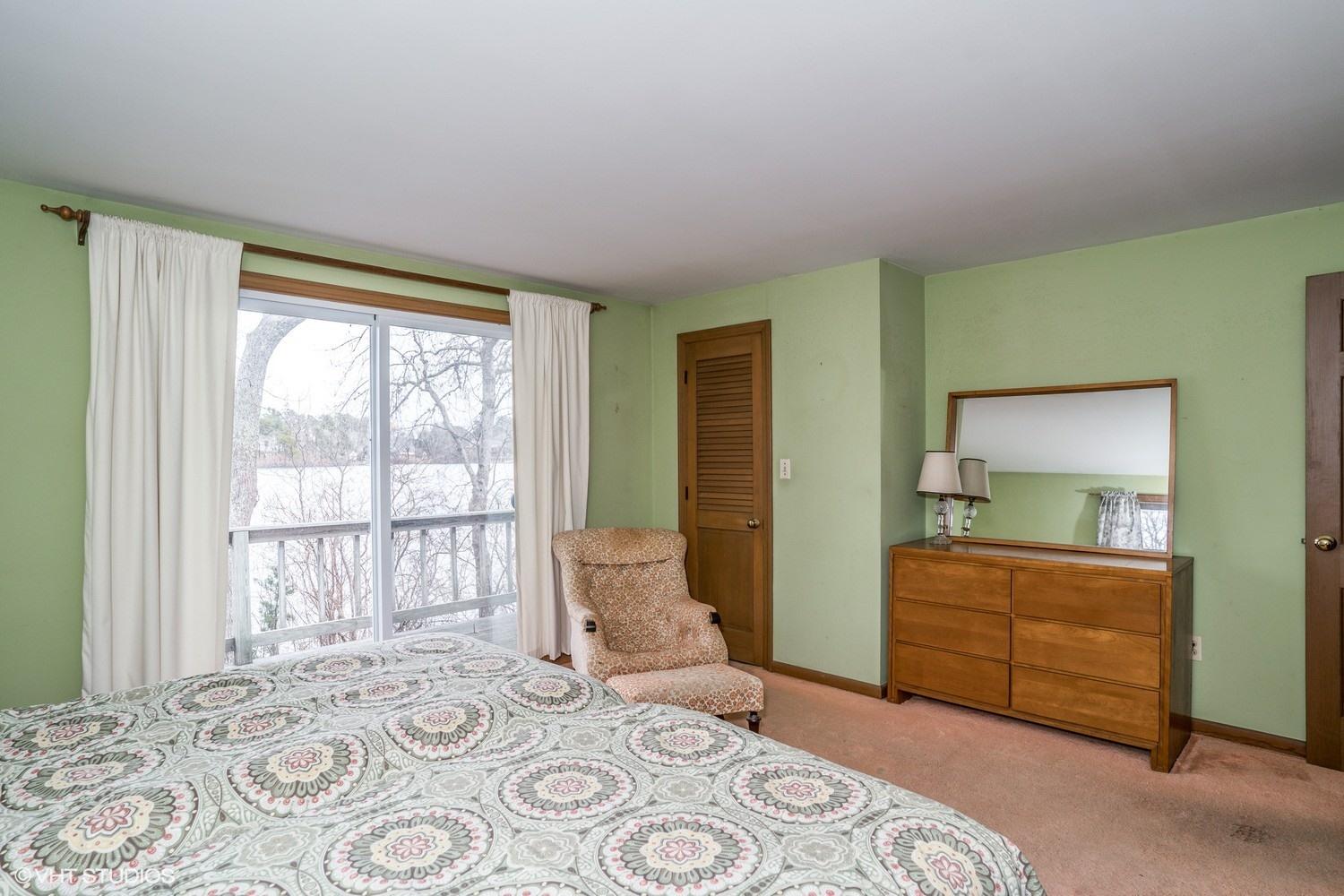 58 Nyes Point Way Centerville, MA 02632 - Photo 8 of 16 a bedroom with a bed and a window