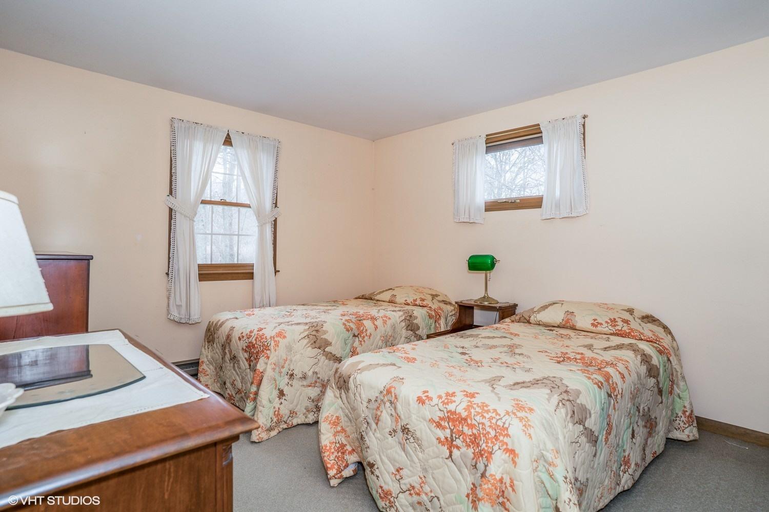 58 Nyes Point Way Centerville, MA 02632 - Photo 9 of 16 a bedroom with two beds and a window