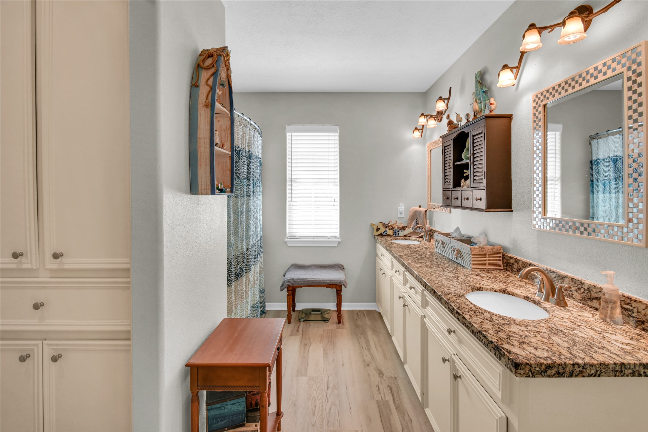 115 Driftwood Road Freeport, TX 77541 - Photo 18 of 21 a bathroom with a granite countertop sink a mirror and a bathtub