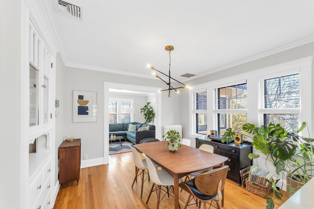 6 Arborough Road, Unit 2 Boston, MA 02131 - Photo 17 of 40 a view of a dining room with furniture window and wooden floor