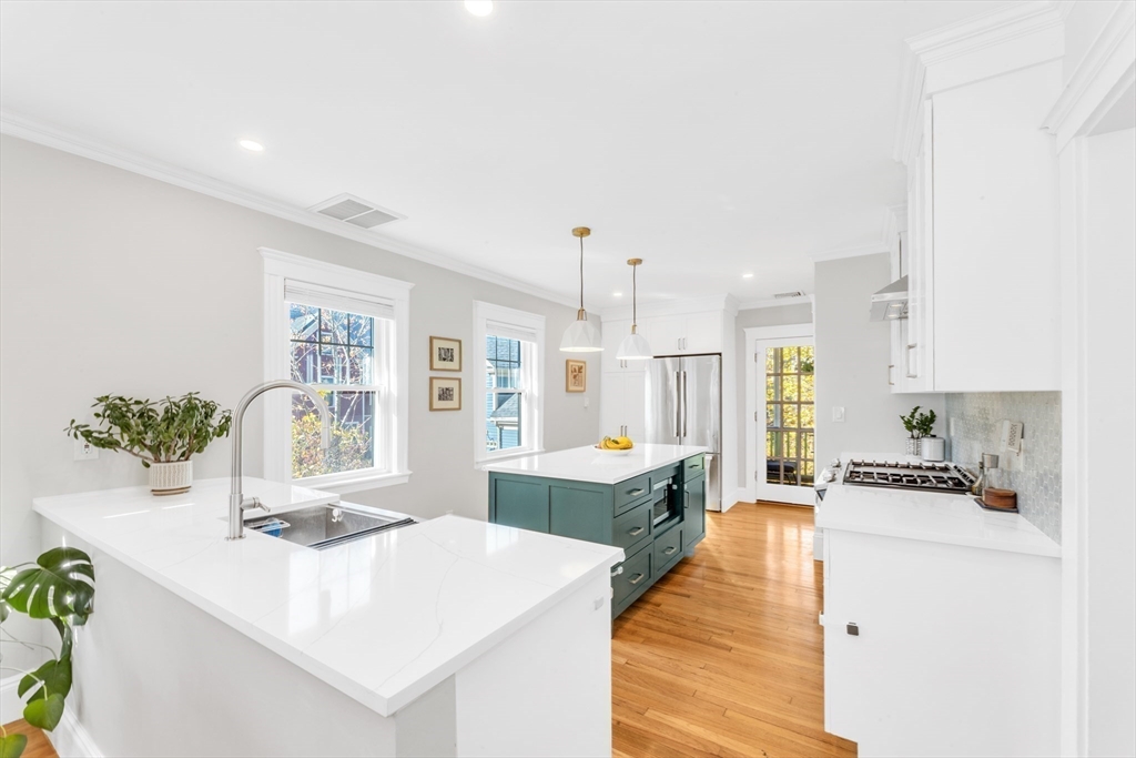 6 Arborough Road, Unit 2 Boston, MA 02131 - Photo 19 of 40 a large white kitchen with a large window