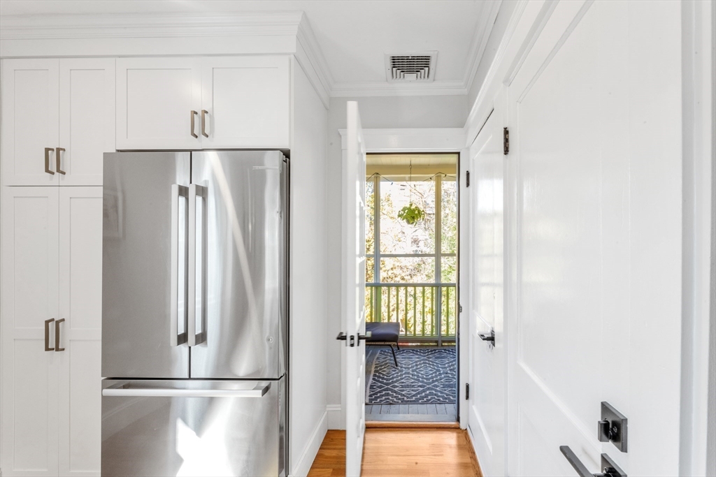 6 Arborough Road, Unit 2 Boston, MA 02131 - Photo 23 of 40 a view of kitchen with refrigerator and wooden floor
