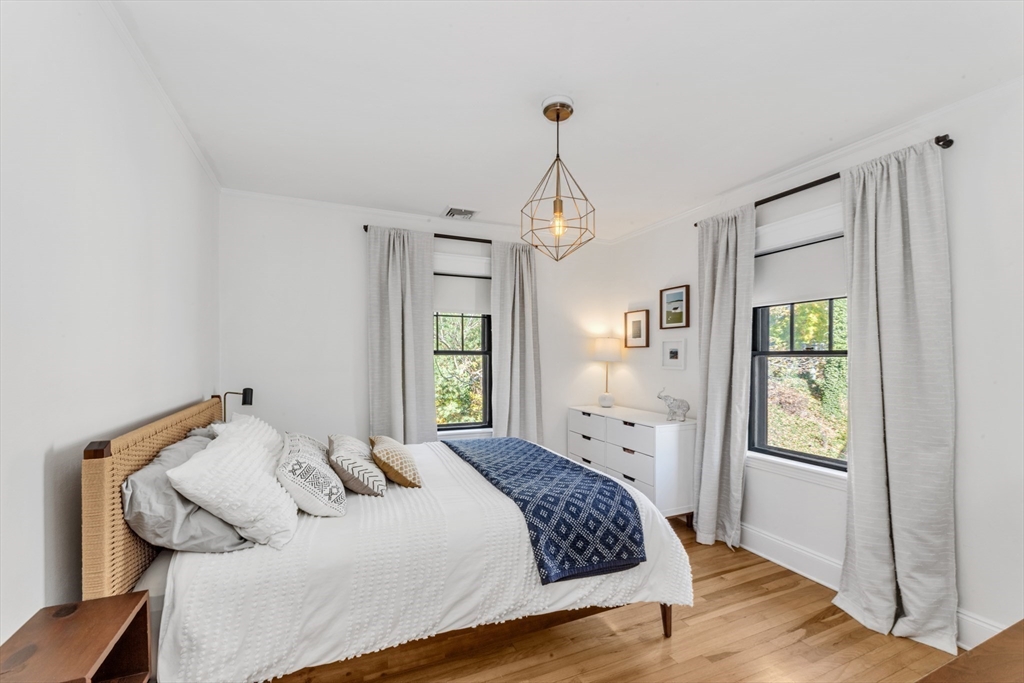 6 Arborough Road, Unit 2 Boston, MA 02131 - Photo 26 of 40 a bedroom with a bed and window