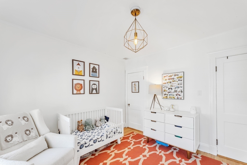 6 Arborough Road, Unit 2 Boston, MA 02131 - Photo 30 of 40 a bedroom with a bed and a window