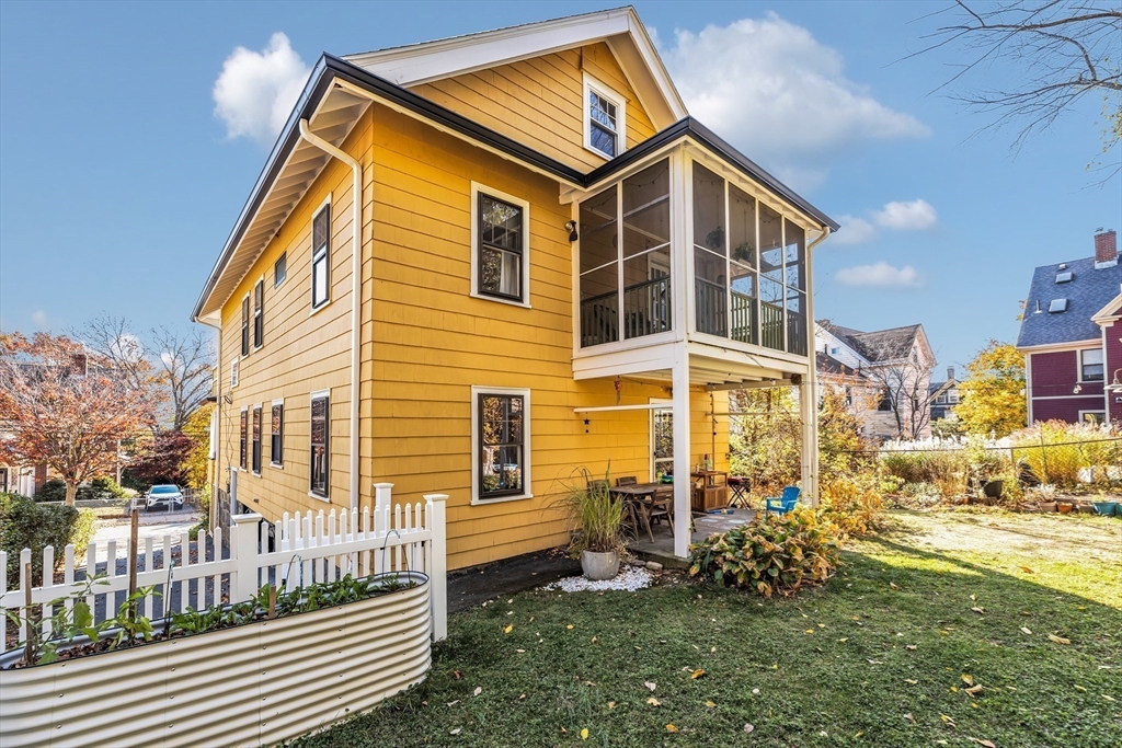 6 Arborough Road, Unit 2 Boston, MA 02131 - Photo 35 of 40 a front view of a house with a yard
