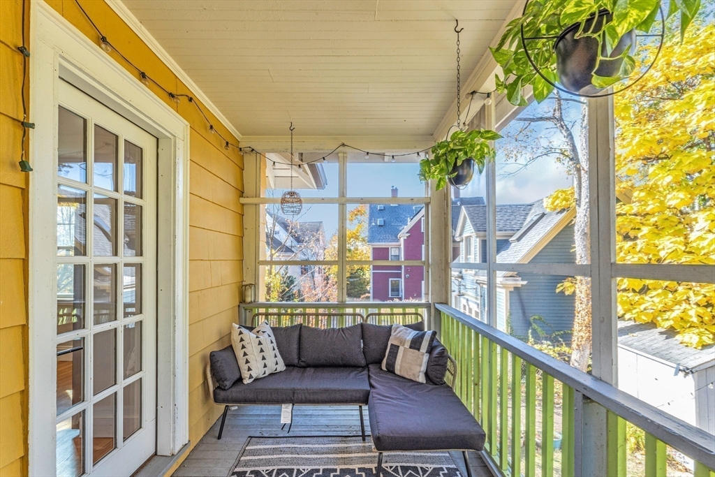 6 Arborough Road, Unit 2 Boston, MA 02131 - Photo 6 of 40 a balcony view with couple of flowers