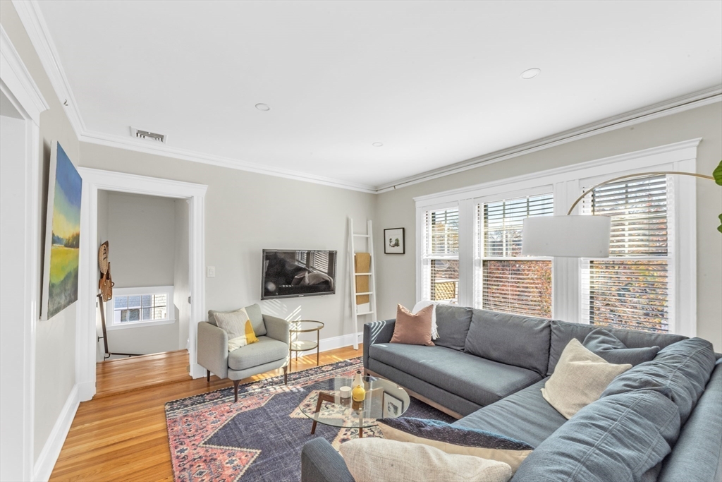 6 Arborough Road, Unit 2 Boston, MA 02131 - Photo 8 of 40 a living room with furniture and a flat screen tv