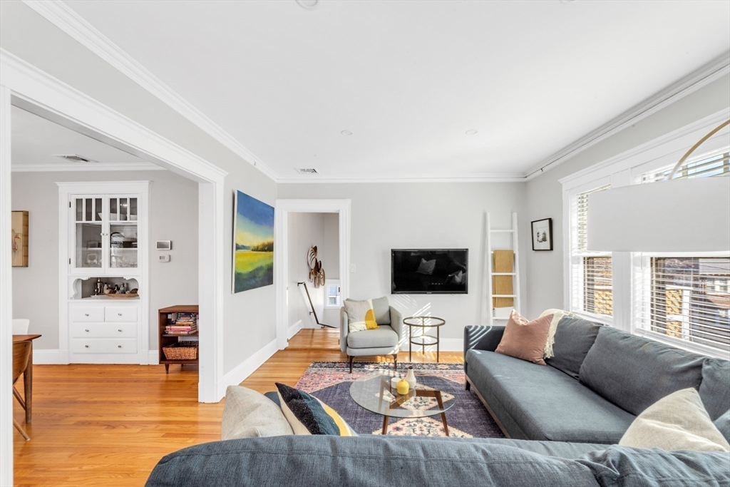 6 Arborough Road, Unit 2 Boston, MA 02131 - Photo 9 of 40 a living room with furniture and a flat screen tv