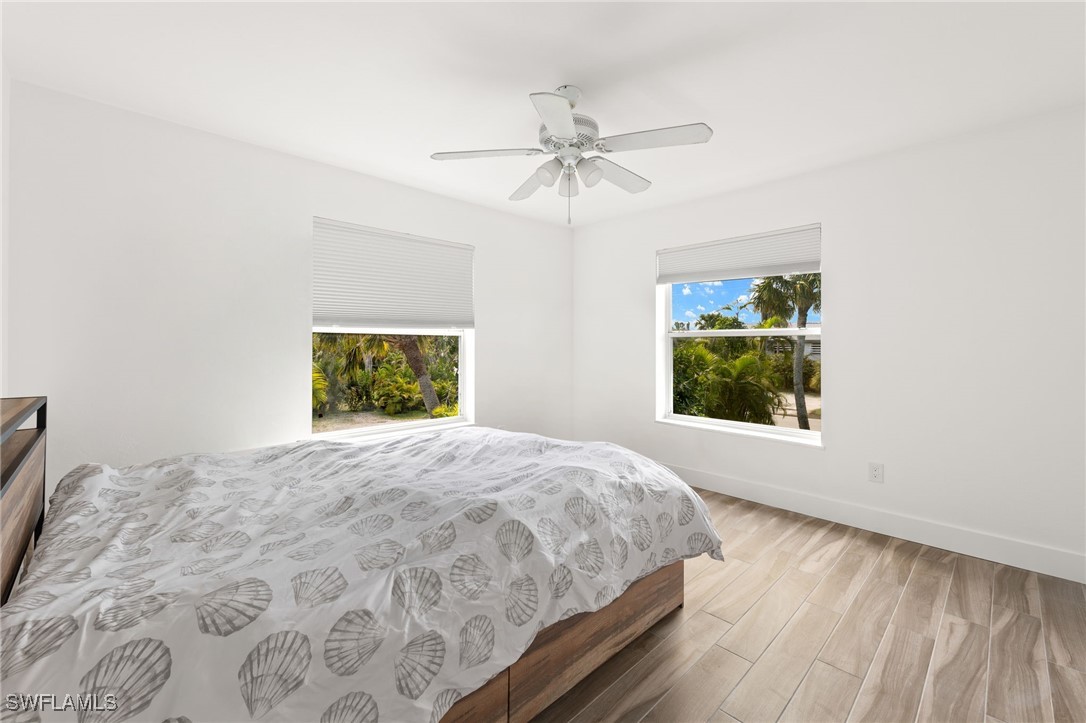 838-840 Rabbit Road Sanibel, FL 33957 - Photo 24 of 38 a bedroom with a bed and a window