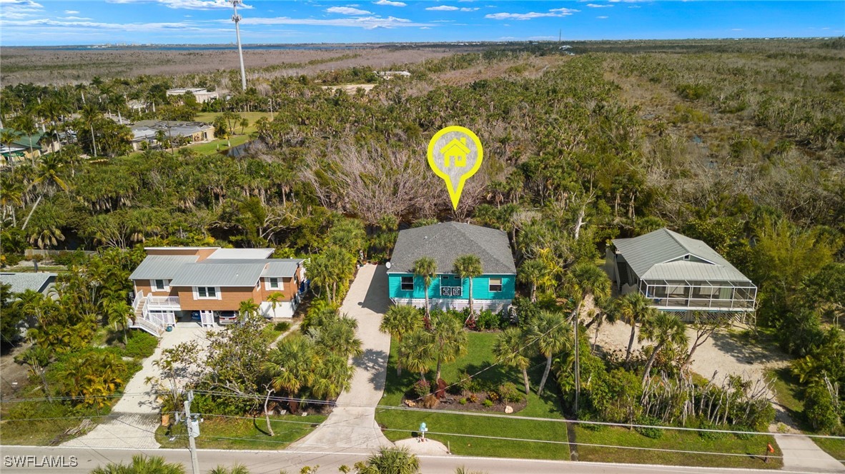 838-840 Rabbit Road Sanibel, FL 33957 - Photo 29 of 38 a view of a house with a swimming pool