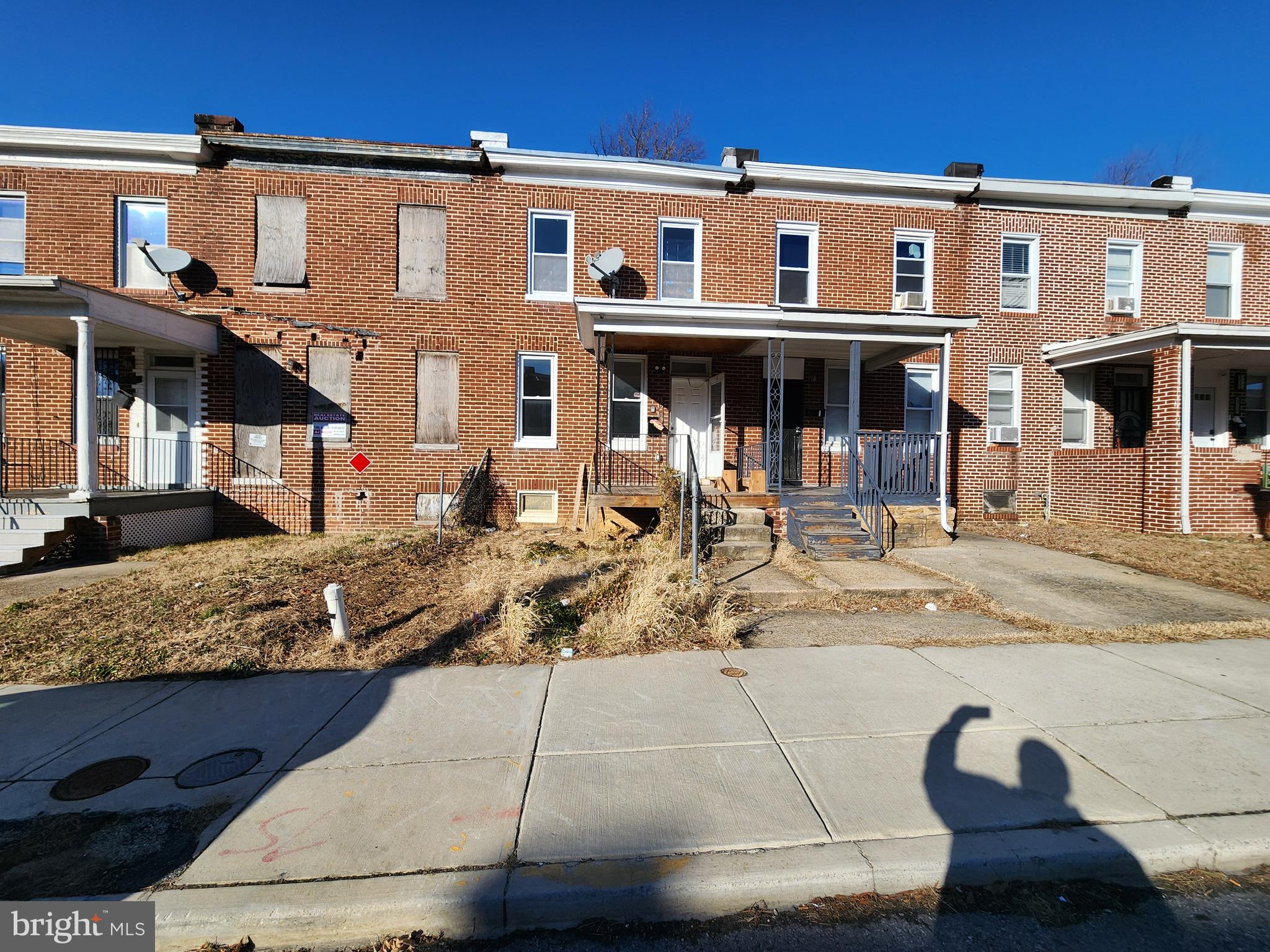 a front view of a house with large windows