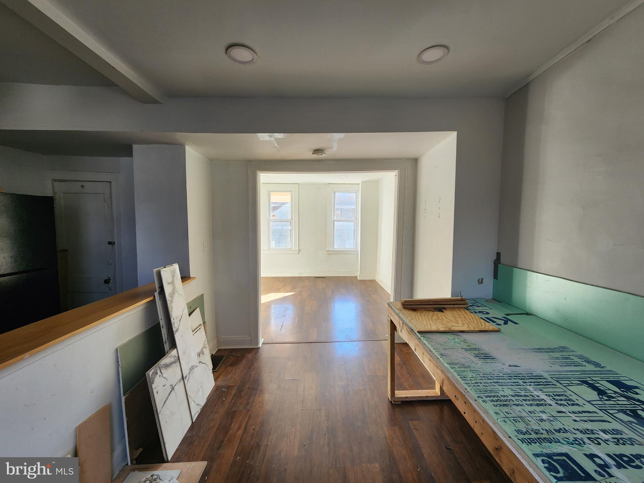 3208 Elmley Avenue Baltimore, MD 21213 - Photo 12 of 30 a living room with furniture and a wooden floor