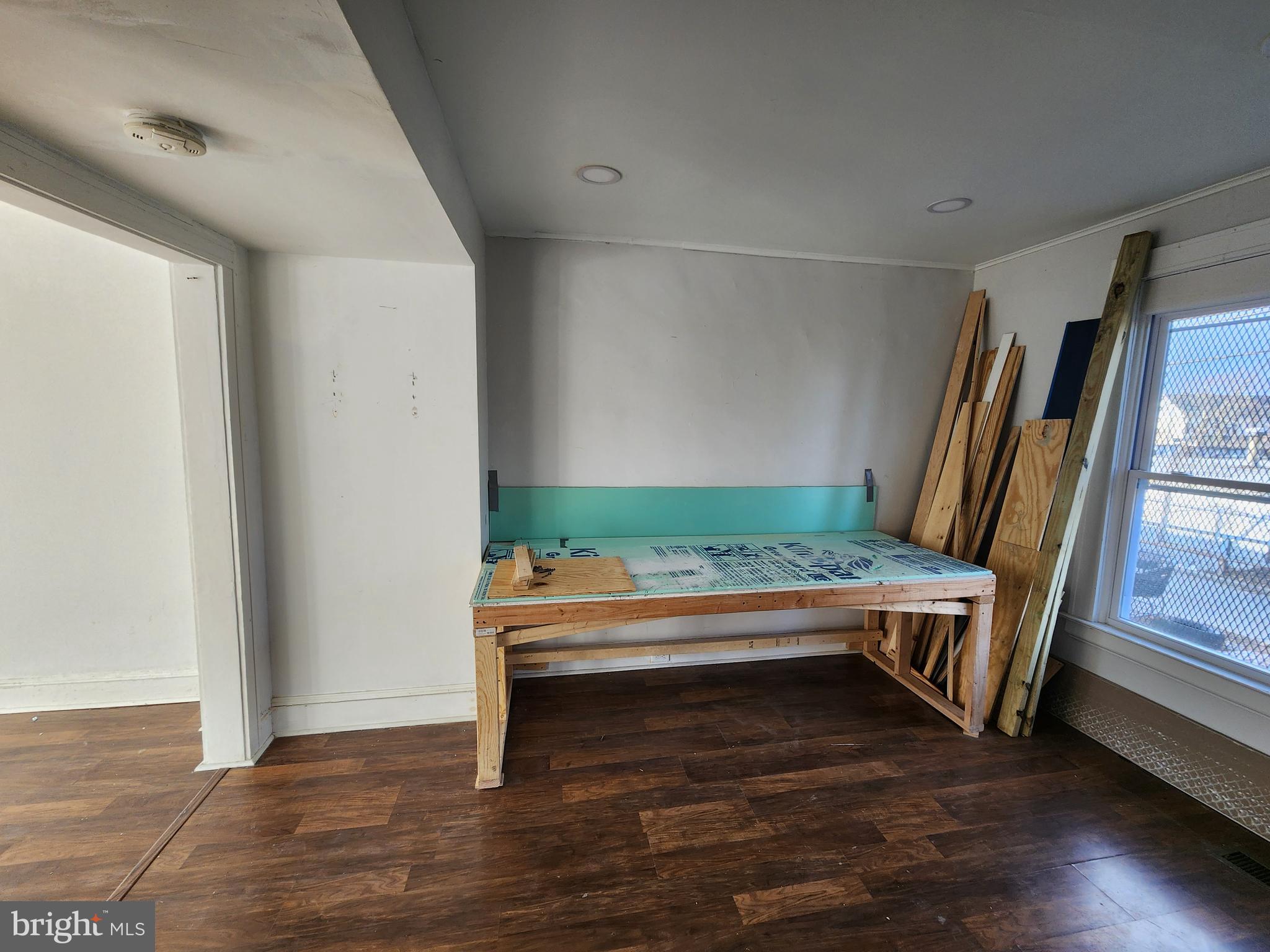 3208 Elmley Avenue Baltimore, MD 21213 - Photo 19 of 30 a room with wooden floor and furniture