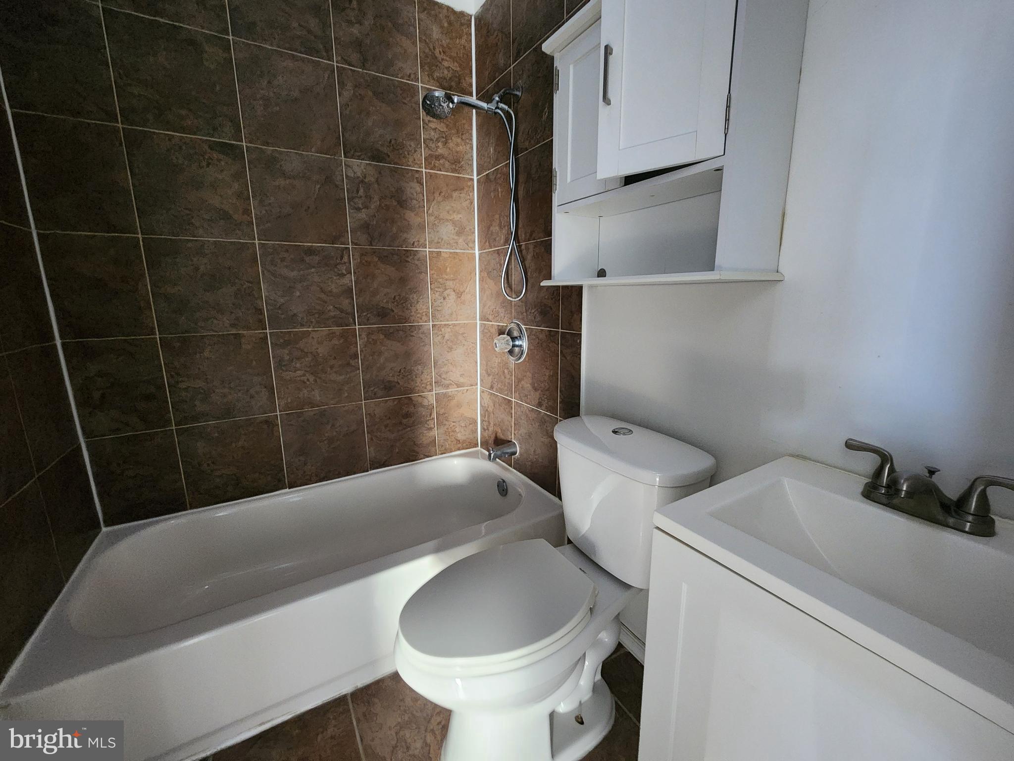 3208 Elmley Avenue Baltimore, MD 21213 - Photo 23 of 30 a bathroom with a toilet and a shower