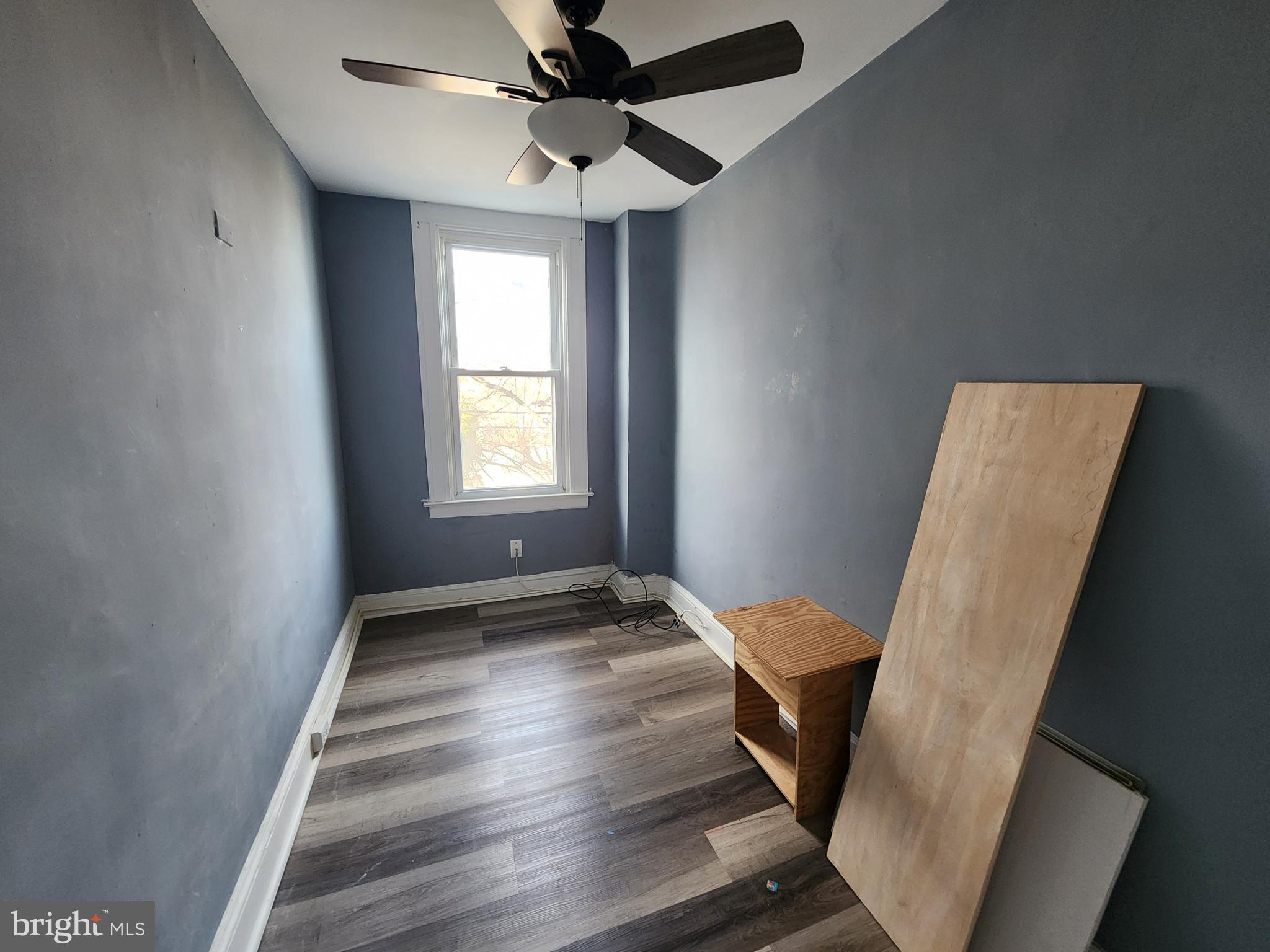 3208 Elmley Avenue Baltimore, MD 21213 - Photo 26 of 30 a view of entryway with stairs and wooden floor