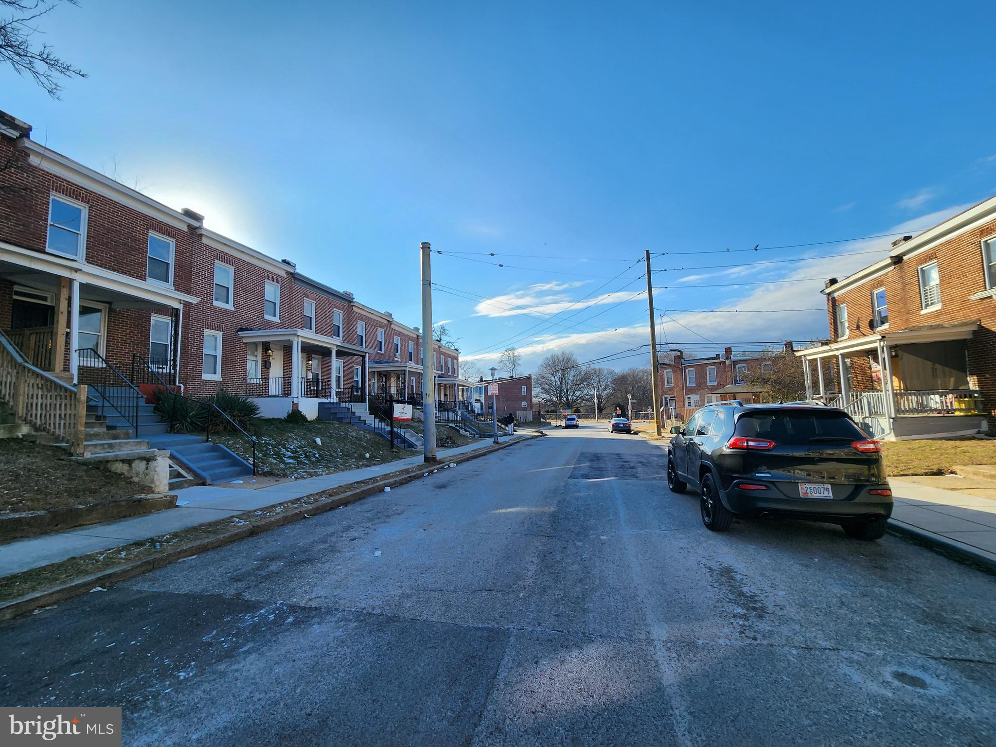 3208 Elmley Avenue Baltimore, MD 21213 - Photo 29 of 30 a view of a car parked in back of a building