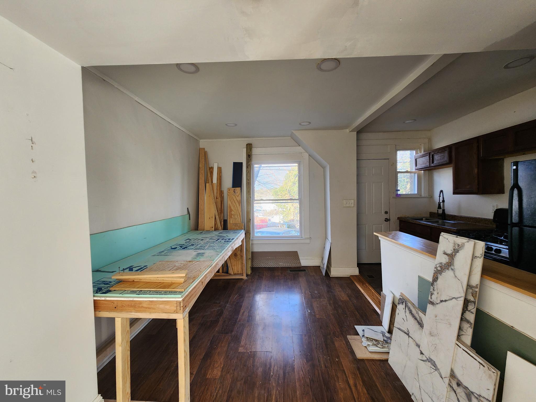 3208 Elmley Avenue Baltimore, MD 21213 - Photo 7 of 30 a room with furniture and a wooden floor