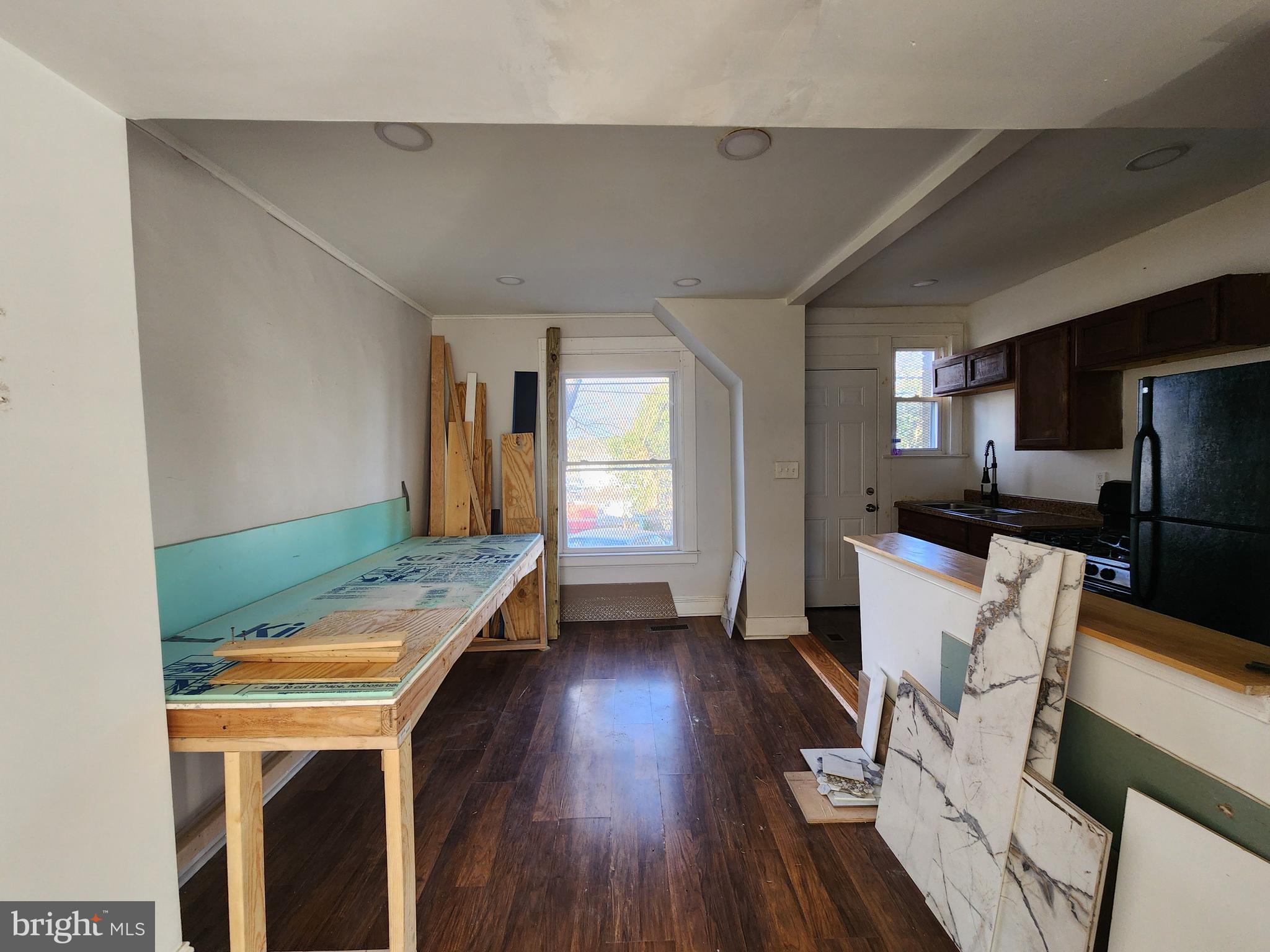 3208 Elmley Avenue Baltimore, MD 21213 - Photo 8 of 30 a room with furniture and a wooden floor