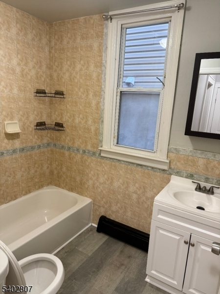 39 Aldine Street Newark, NJ 07112 - Photo 7 of 7 a bathroom with a sink and a bathtub
