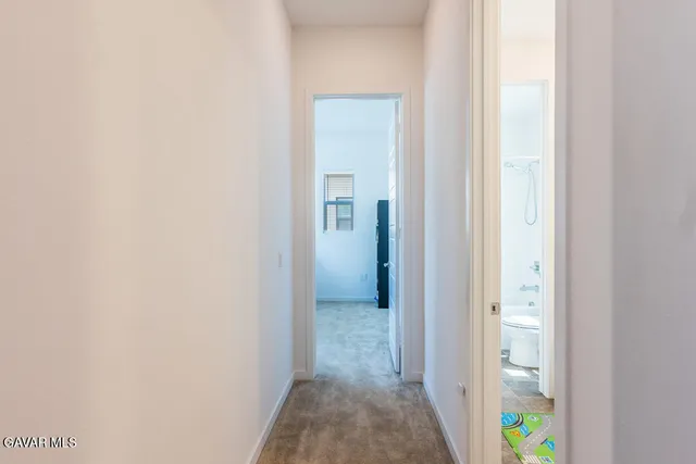 a room with a chair and a window