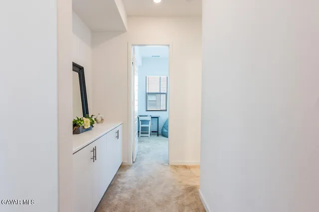 a bedroom with a bed and a cabinets