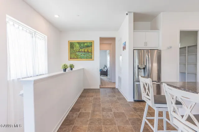 a view of a workspace with furniture