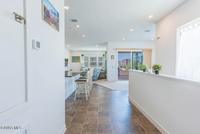 a view of an empty room with closet