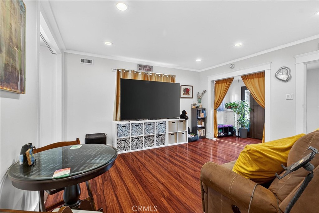 1524 East Hellman Street Long Beach, CA 90813 - Photo 15 of 33 a living room with furniture and a flat screen tv