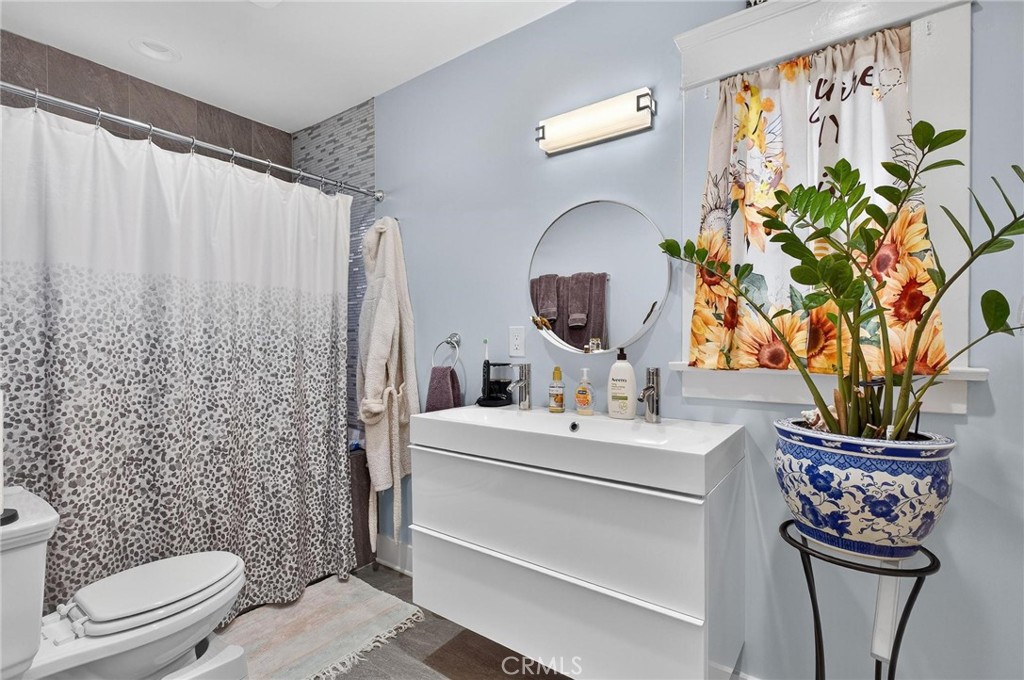 1524 East Hellman Street Long Beach, CA 90813 - Photo 22 of 33 a bathroom with a sink toilet and shower