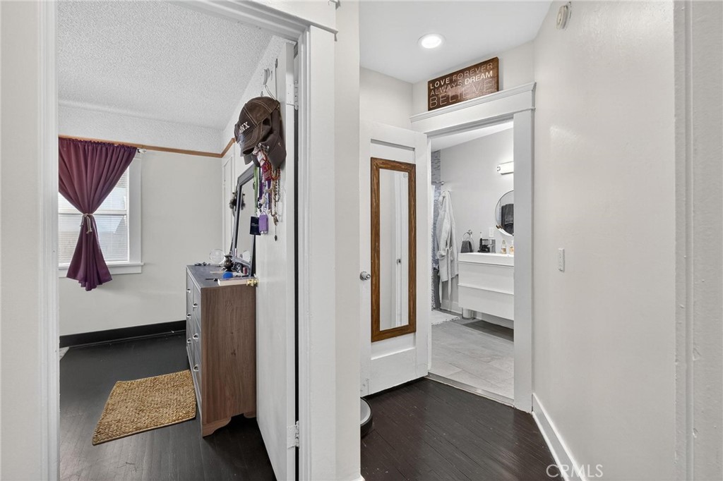 1524 East Hellman Street Long Beach, CA 90813 - Photo 23 of 33 a view of hallway with walk in closet and wooden floor