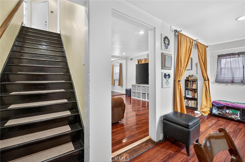 1524 East Hellman Street Long Beach, CA 90813 - Photo 24 of 33 a view of a hallway with wooden floor and windows