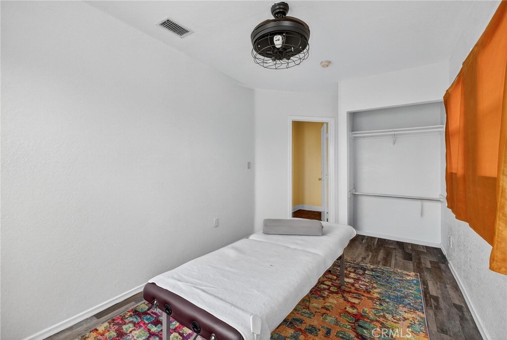 1524 East Hellman Street Long Beach, CA 90813 - Photo 30 of 33 a view of a room with rack and wooden floor