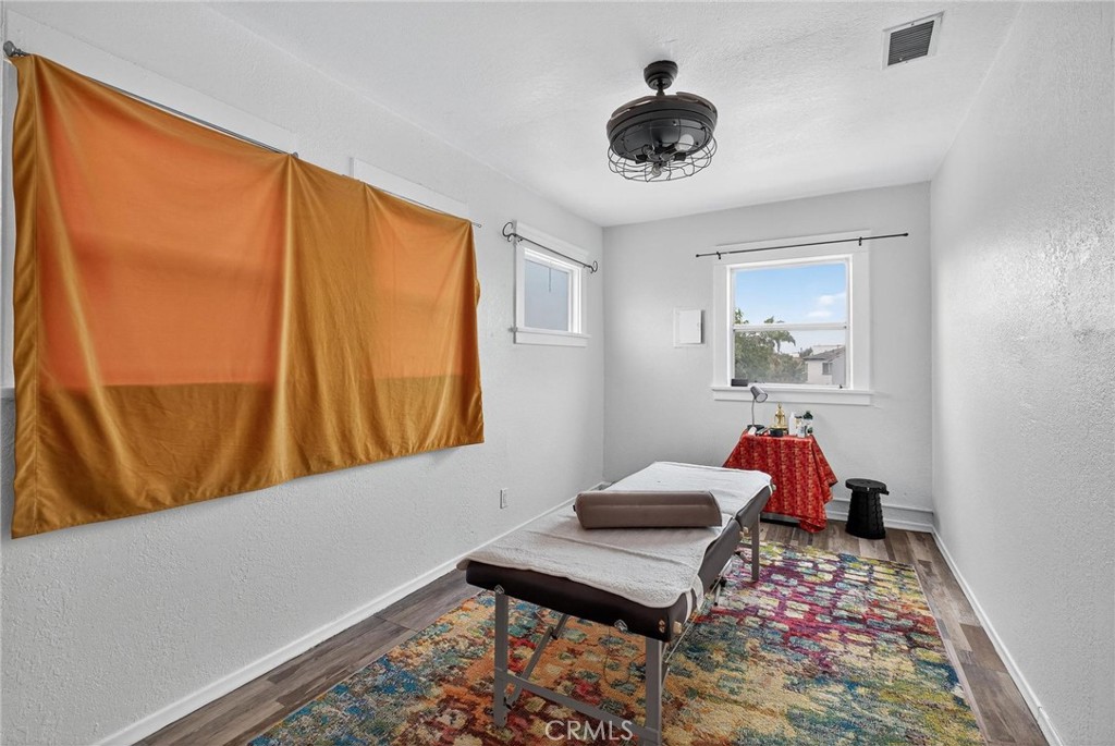 1524 East Hellman Street Long Beach, CA 90813 - Photo 31 of 33 a living room with furniture and a window