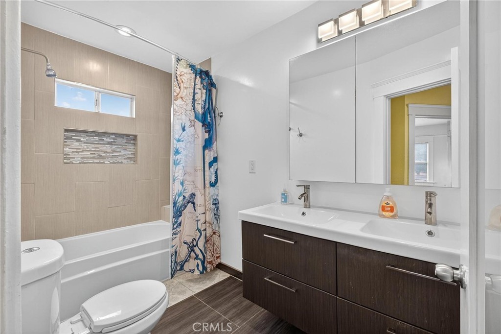 1524 East Hellman Street Long Beach, CA 90813 - Photo 32 of 33 a bathroom with a sink a toilet and shower