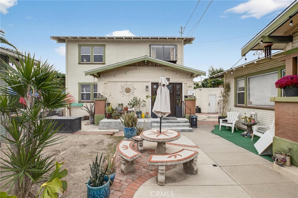 1524 East Hellman Street Long Beach, CA 90813 - Photo 6 of 33 a view of a patio with couches table and chairs and potted plants