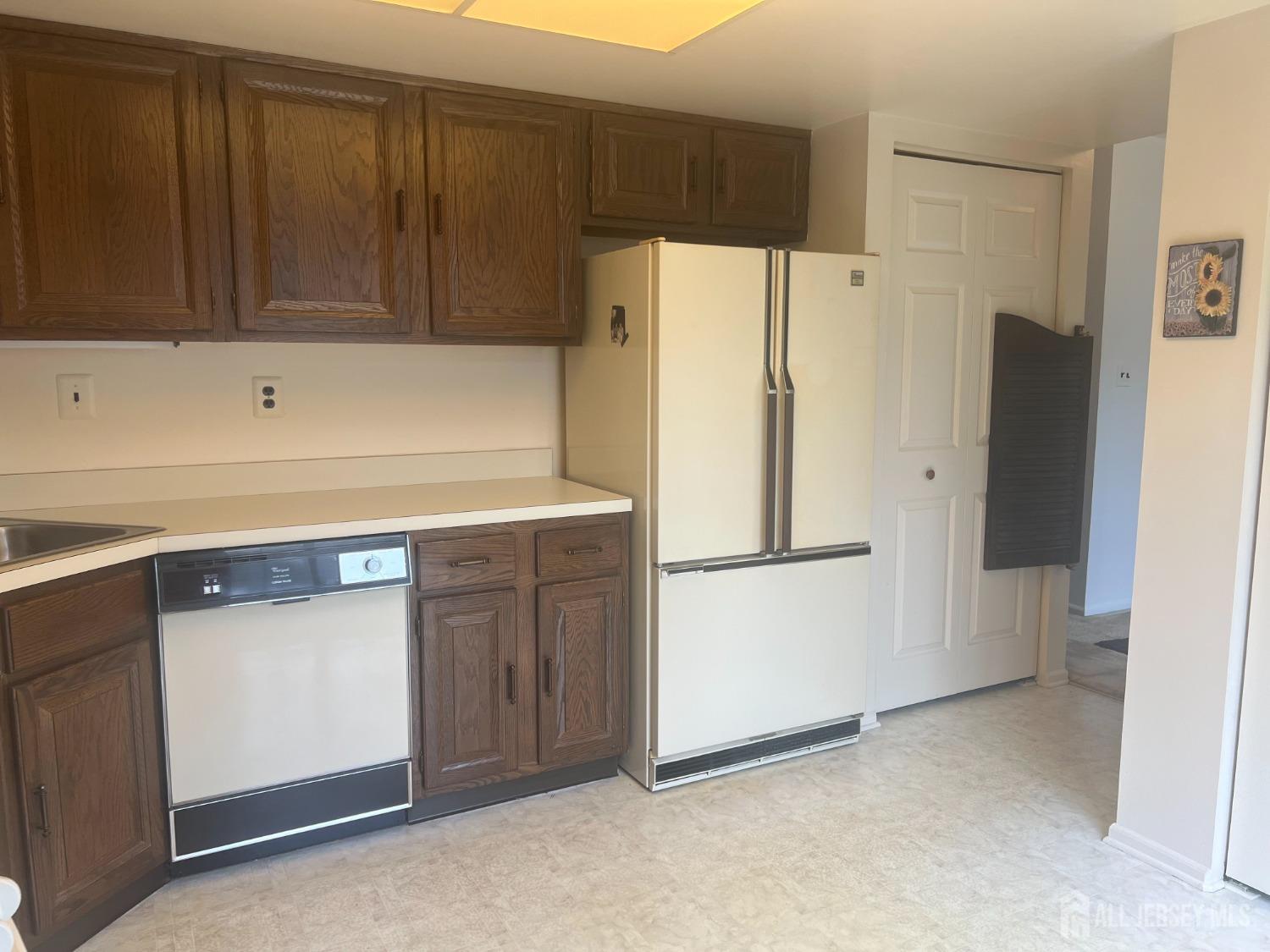 143 Archery Court Old Bridge, NJ 08857 - Photo 15 of 29 a white refrigerator freezer sitting in a kitchen